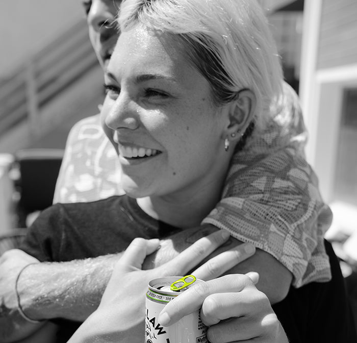 Some friends drinking Natural Lime WHITE CLAW®