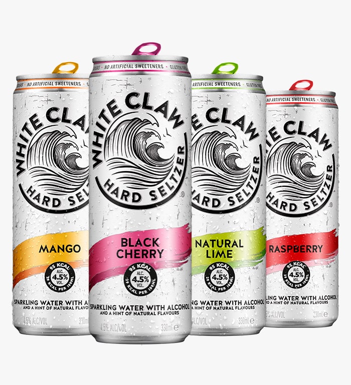 Four WHITE CLAW® cans stand in a line to represent the options in a Variety Pack. 